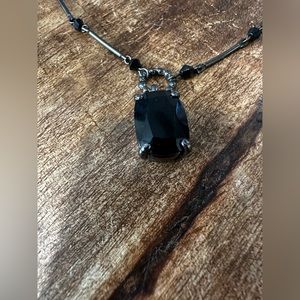 Black gems and silver necklace